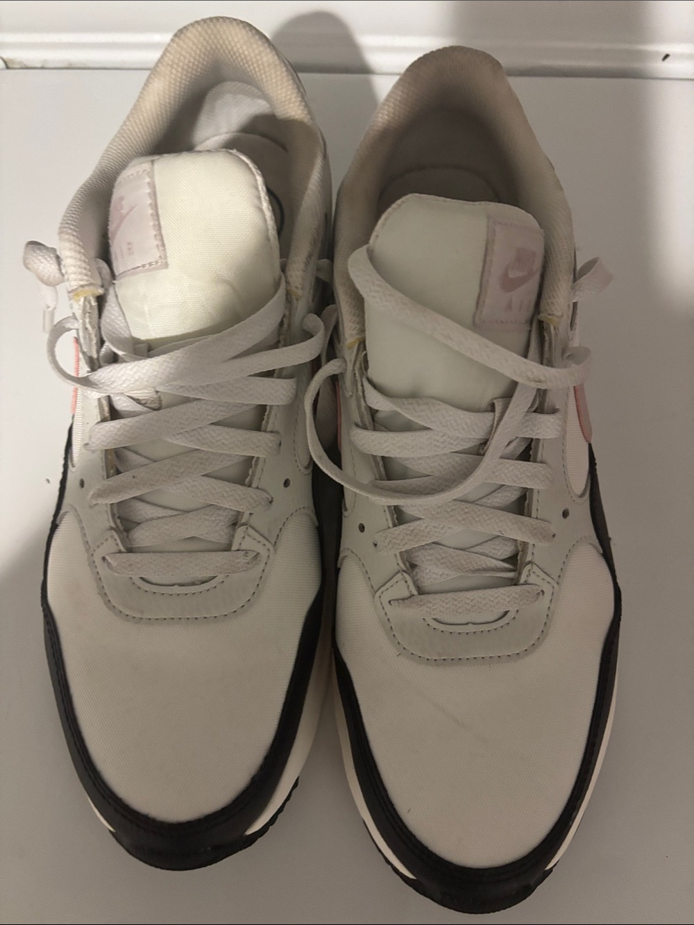 Nike White and Black Low-Top Sneakers with Pink Accents